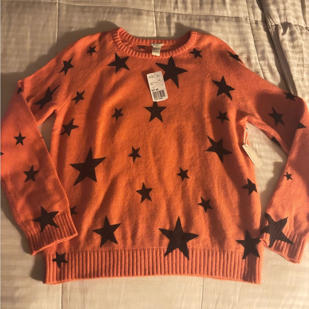 Forever 21 Orange Sweater with Black Star Design